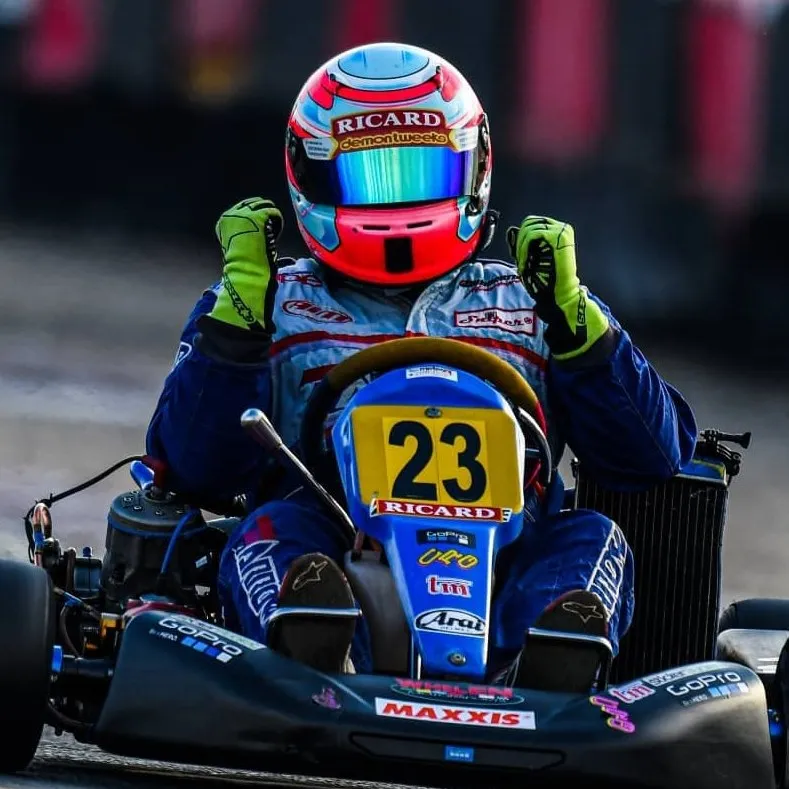 Glenn in the #23 kart, fists raised